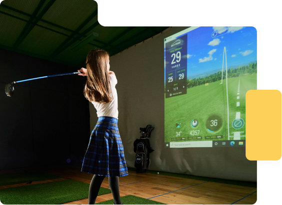 Girl using golf simulator