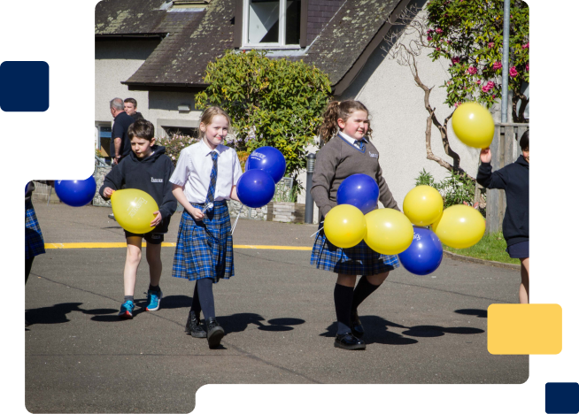 Students carrying balloons