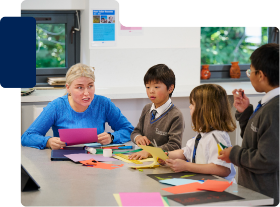 Teacher speaking with young students